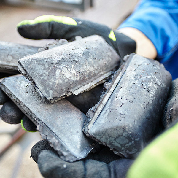 man with gloves on holding HBI