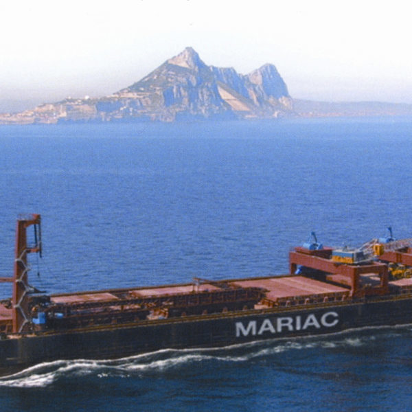 Mariac vessel on the ocean with mountain views in the distance